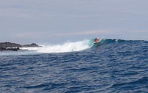 Andresito pulling it hard off the top of the wave at Chicken Hill, Galapagos Islands.